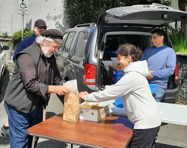 Handing out bagged lunches to the most vulnerable in our community