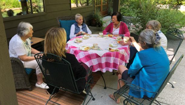 Group of people around a table talking