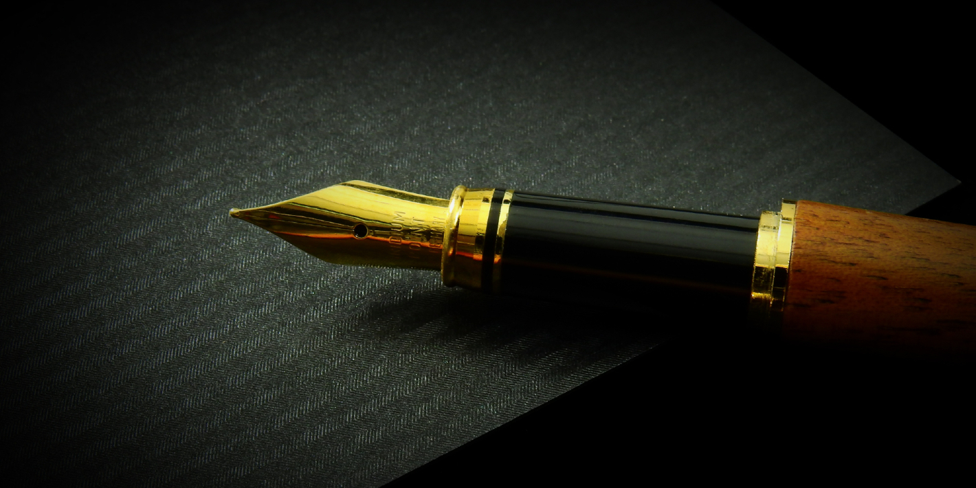 Fountain pen on a black background